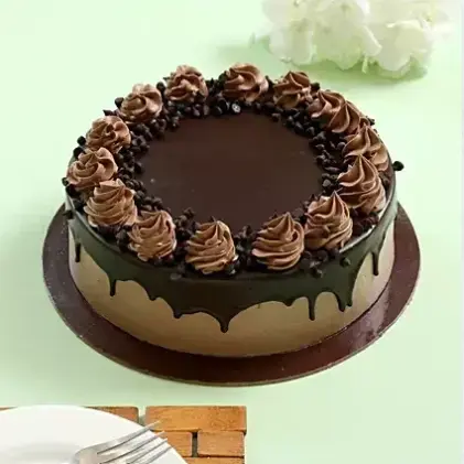 Birthday Chocolate Cake (MB357) by the best bakery cakes shop in Aligarh, rich chocolate drip cake with smooth ganache topping and creamy chocolate rosettes.