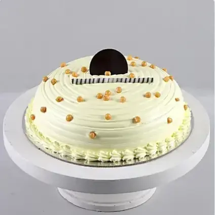 Butter Scotch Friendship Cake (MB366) by Best Bakery Cakes Shop in Aligarh, butterscotch cake with smooth cream frosting, caramel balls and elegant chocolate décor