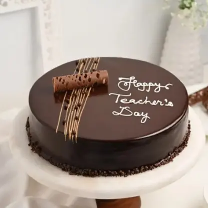Teacher’s Day Cake (MB1319) from the best bakery cakes shop in Aligarh, elegant chocolate cake with smooth ganache finish, decorative chocolate rolls, and “Happy Teacher’s Day” message