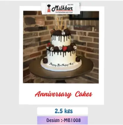 Anniversary Cake (MB1008) – Two tier chocolate drip anniversary cake with strawberries and chocolates from the best bakery cakes shop in Aligarh
